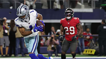 Dec 22, 2024; Arlington, Texas, USA; Dallas Cowboys wide receiver Jalen Tolbert (1) catches a touchdown pass against Tampa Bay Buccaneers linebacker Lavonte David (54) in the first quarter at AT&T Stadium. Mandatory Credit: Tim Heitman-Imagn Images