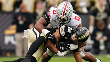 Ohio State Buckeyes linebacker Sonny Styles (0) tackles Purdue Boilermakers running back Antonio Harris (22) during the NCAA football game at Ross-Ade Stadium in West Lafayette, Ind. on Nov. 8, 2025.