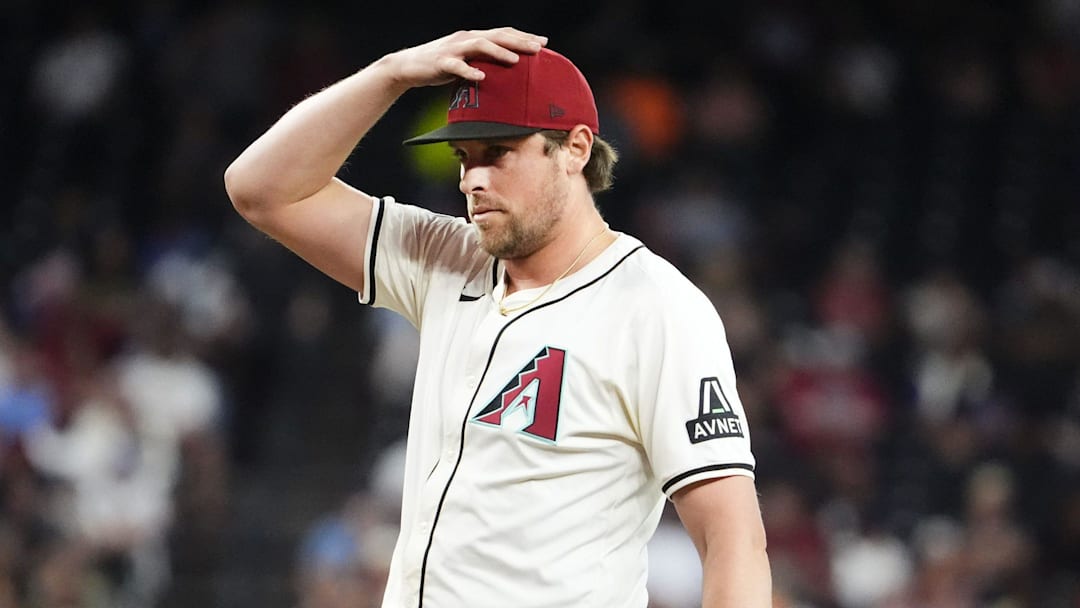 Arizona Diamondbacks pitcher Kevin Ginkel reacts after allowing Houston Astros' Christian Walker to hit the game-winning RBI-single in the ninth inning at Chase Field in Phoenix on July 23, 2025.