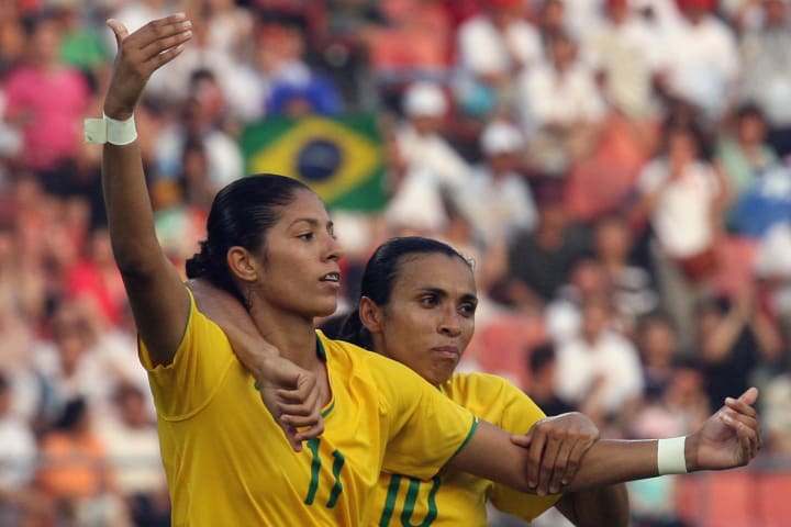 Brazil's Marta (R) celebrates with goals