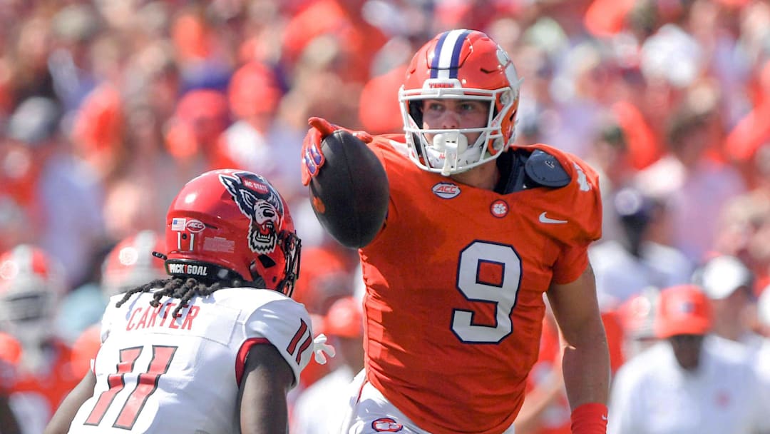 Sep 21, 2024; Clemson, South Carolina, USA; Clemson Tigers tight end Jake Briningstool (9) points for a first down against North Carolina State Wolfpack safety Ja'Had Carter (11) during the first quarter at Memorial Stadium. Mandatory Credit: Ken Ruinard-Imagn Images