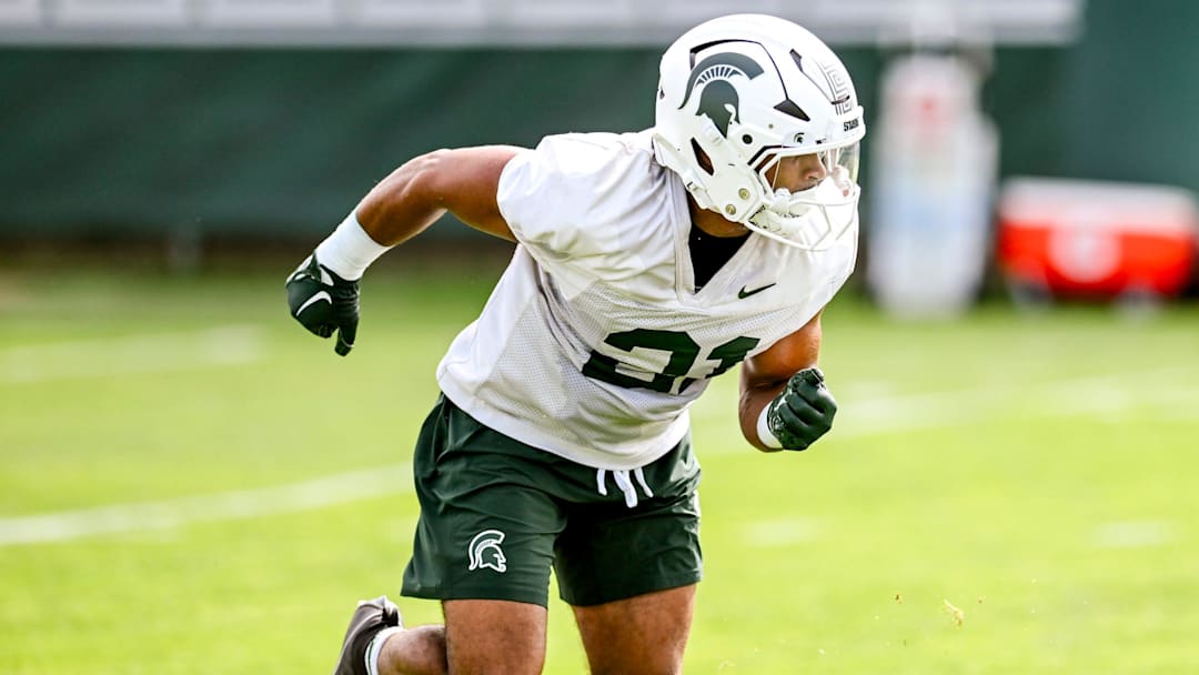 Michigan State's Dillon Tatum runs a drill during the first day of football camp on Tuesday, July 30, 2024, in East Lansing.