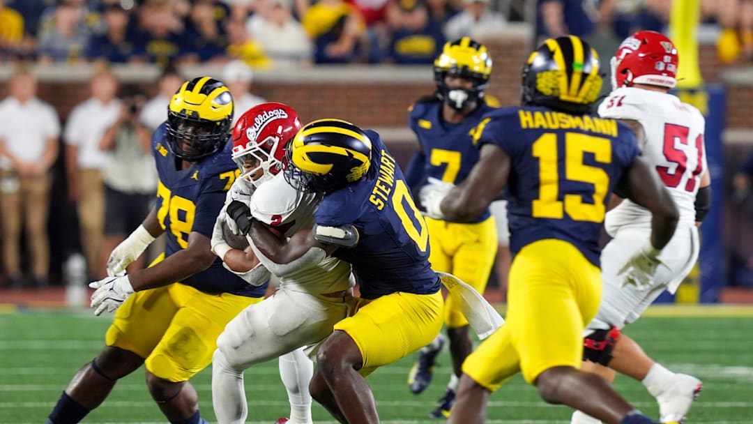 Michigan edge rusher Josaiah Stewart (0) tackles Fresno State running back Malik Sherrod (2) during the second half at Michigan Stadium in Ann Arbor on Saturday, Aug. 31, 2024.