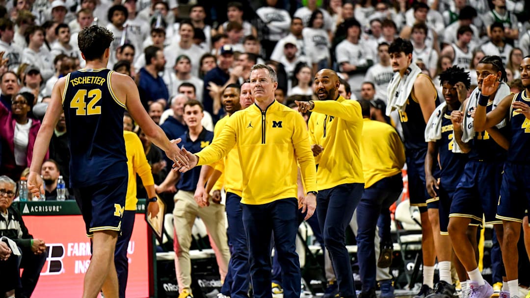 Michigan's head coach Dusty May, right, slaps hands with Will Tschetter during the second half in the game against Michigan State on Friday, Jan. 30, 2026, at the Breslin Center in East Lansing.