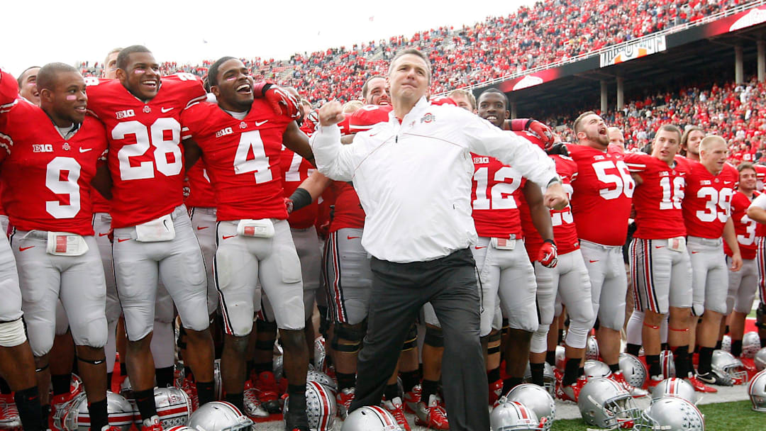 Ohio State Buckeyes head coach Urban Meyer gives a fist pump to the student section following the Buckeyes' 29-22 win over Purdue in the NCAA football game at Ohio Stadium in Columbus on Saturday, Oct. 20, 2012. (Dispatch photo by Adam Cairns)