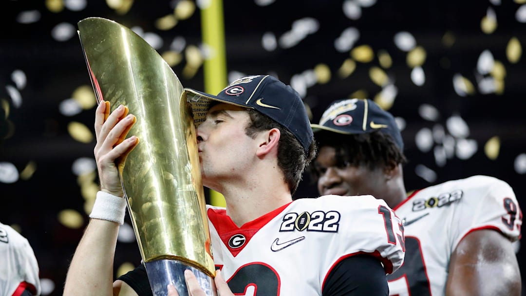 Georgia Bulldogs quarterback Stetson Bennett (13) kisses the trophy after winning the College Football Playoff National Championship on Monday, Jan. 10, 2022, at Lucas Oil Stadium in Indianapolis.

Alabama Crimson Tide Versus Georgia Bulldogs On Monday Jan 10 2022 College Football Playoff National Championship At Lucas Oil Stadium In Indianapolis

Syndication The Indianapolis Star