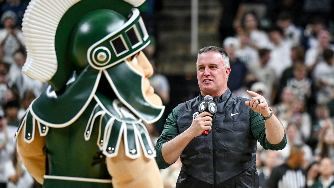 Michigan State's new football coach Pat Fitzgerald addresses the crowd during a timeout in the first half of the Spartans basketball game against Iowa on Tuesday, Dec. 2, 2025, at the Breslin Center in East Lansing.