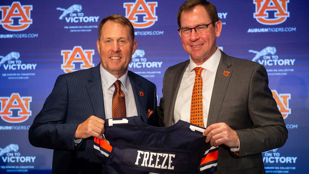 Auburn Tigers football coach Hugh Freeze and athletic director John Cohen pose for photos during Freeze's introduction at the Woltosz Football Performance Center.