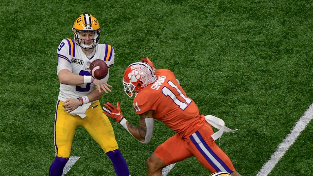 LSU quarterback Joe Burrow (9) throws near Clemson safety Isaiah Simmons (11) during the first quarter at the Mercedes Benz Superdome in the National Championship football game in New Orleans Monday, January 13, 2020.

Clemson Lsu Football Cfp National Championship New Orleans
