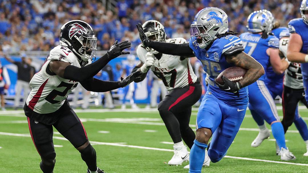 Detroit Lions running back Jahmyr Gibbs (26) runs against Atlanta Falcons safety Richie Grant (27) during the second half at Ford Field in Detroit on Sunday, Sept. 24, 2023.