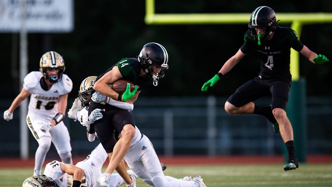 Luke Garvin (14) and Fossil Ridge lost to Columbine 35-21 on Thursday, Sept. 12, 2024.