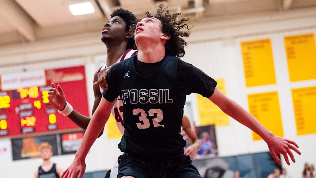 Fossil Ridge's Malachai Egbuji looks for a rebound during a city rivalry high school basketball game against Rocky Mountain on Tuesday, Jan. 28, 2025 at Rocky Mountain High School in Fort Collins, Colo.