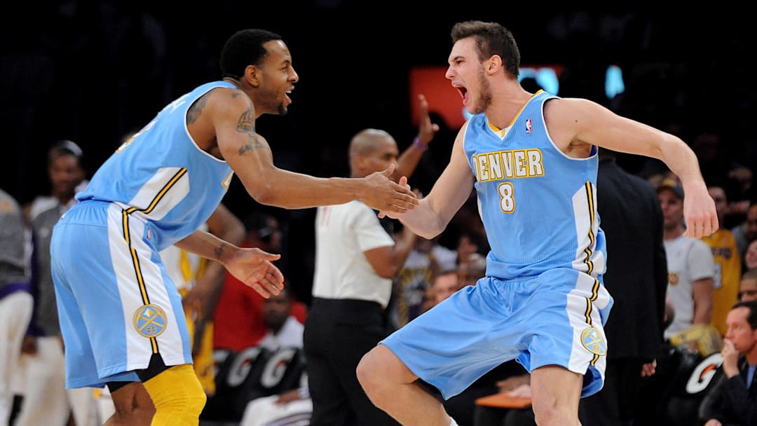 January 6, 2013;  Los Angeles, CA, USA;   Denver Nuggets small forward Danilo Gallinari (8) reacts with shooting guard Andre Iguodala (9) after he hit a 3-point shot with 13 seconds left on the clock in the game against the Los Angeles Lakers at the Staples Center. Nuggets won 112-105. Mandatory Credit: Jayne Kamin-Oncea-Imagn Images