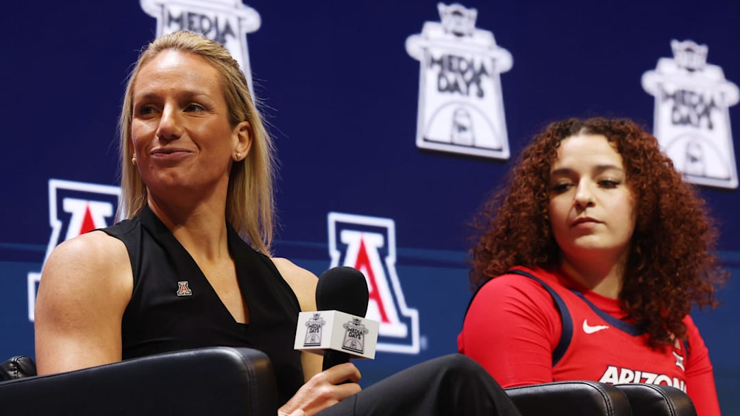 Oct 21, 2025; Kansas City, MO, USA; Arizona head coach Becky Burke (left) and Mickayla Perdue (right) speaks to media during Big 12 Womenís Basketball Media Day at T-Mobile Center. Mandatory Credit: Sophia Scheller-Imagn Images