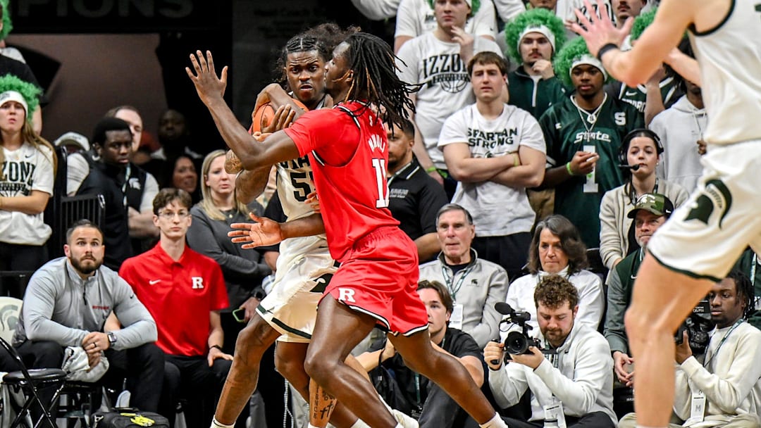 Michigan State's Coen Carr, left, is pressured by Rutgers' Chris Nwuli during the second half on Thursday, March 5, 2026, at the Breslin Center in East Lansing.