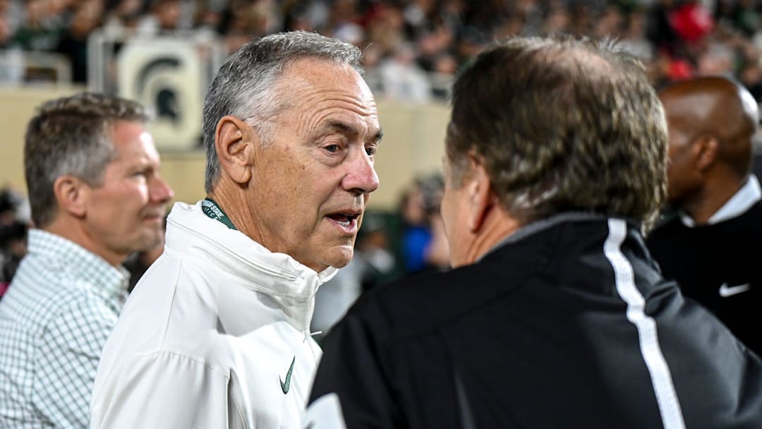 Michigan State former head coach Mark Dantonio, left, talks with Tom Izzo on the sideline during the first quarter in the game against Ohio State on Saturday, Sept. 28, 2024, at Spartan Stadium in East Lansing. Michigan State former head coach Mark Dantonio, left, talks with Tom Izzo on the sideline during the first quarter in the game against Ohio State on Saturday, Sept. 28, 2024, at Spartan Stadium in East Lansing.