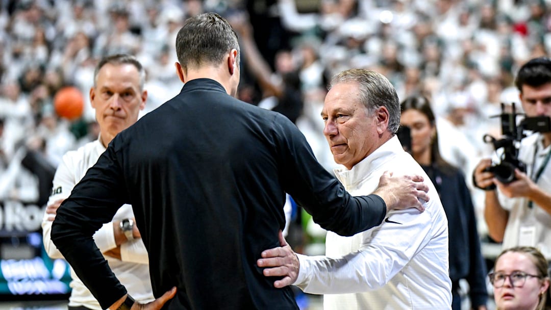 Michigan State's head coach Tom Izzo, right, meets with Duke's head coach Jon Scheyer before the game on Saturday, Dec. 6, 2025, at the Breslin Center in East Lansing.