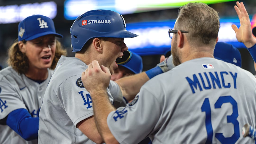 Dodgers catcher Will Smith, center, hit the go-ahead home run in the 11th inning.