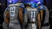 Detroit Lions receivers including Donovan Peoples-Jones and Kalif Raymond pray before the start of a game.