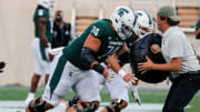 Michigan State offensive lineman Geno VanDeMark (74) warms up before the game against Western