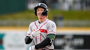 Lugnuts' Henry Bolte smiles after an out in the second inning on Wednesday, April 3, 2024, during the Crosstown Showdown against Michigan State at Jackson Field in Lansing.