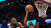 Mar 31, 2025; Washington, District of Columbia, USA; Miami Heat center Bam Adebayo (13) rebounds the ball with guard Terry Rozier (2) during the third quarter against the Washington Wizards at Capital One Arena. Mandatory Credit: Reggie Hildred-Imagn Images