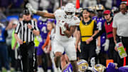 Texas Longhorns tight end Ja'Tavion Sanders (0) evades the Washington Huskies defense during the Sugar Bowl College Football Playoff semi-finals at the Ceasars Superdome in New Orleans, Louisiana, Jan. 1, 2024. The Huskies won the game over the Texas Longhorns 37-31.