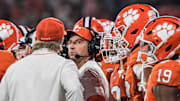 Clemson Tigers head coach Dabo Swinney in a team huddle against the Louisville Cardinals.