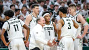 Michigan State coach Tom Izzo talks with his team during a timeout.