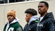 Michigan State basketball players, from left, Tre Holloman, Jeremy Fears and Coen Carr take in the