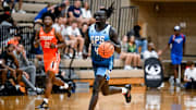 Team SPS and Michigan State's Kur Teng moves the ball against Team Snipes during the Moneyball Pro-Am on Tuesday, July 15, 2025, at Holt High School.