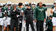 Michigan State's head coach Jonathan Smith, center, looks on from the sideline during the third quarter in the game against UCLA on Saturday, Oct. 11, 2025, at Spartan Stadium in East Lansing.