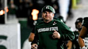 Michigan State's head coach Jonathan Smith runs onto the field with the team before the gam against Michigan Saturday, Oct. 25, 2025, at Spartan Stadium in East Lansing.