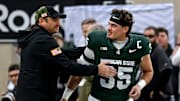 Michigan State senior Sam Edwards, right, is recognized by head coach Jonathan Smith during a ceremony before the game against Penn State on Saturday, Nov. 15, 2025, at Spartan Stadium in East Lansing.