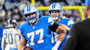 Detroit Lions quarterback Jared Goff talks to center Frank Ragnow before the Tennessee Titans game at Ford Field