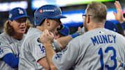Dodgers catcher Will Smith, center, hit the go-ahead home run in the 11th inning.