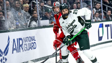 Michigan State's Gavin O'Connell clears the puck against Ohio State in the second period of the Big