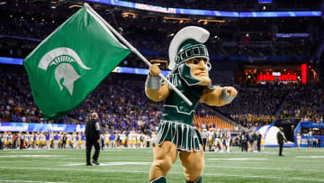 Sparty cheer for Michigan State before kickoff of the Peach Bowl at the Mercedes-Benz Stadium in