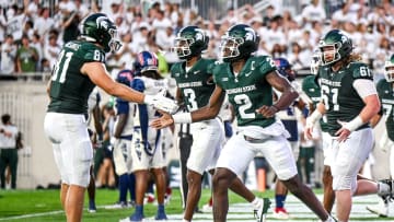 Michigan State's Aidan Chiles, right, celebrates his touchdown with Michael Masunas during the second quarter in the game against Florida Atlantic on Friday, Aug. 30, 2024, at Spartan Stadium in East Lansing.