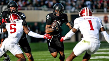 Michigan State's Alante Brown, center, runs the ball against Indiana during the first quarter on Saturday, Nov. 2, 2024, at Spartan Stadium in East Lansing.
