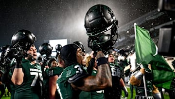 Michigan State's Montorie Foster Jr., center, and the team celebrate after defeating Purdue on Friday, Nov. 22, 2024, at Spartan Stadium in East Lansing.