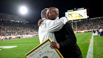 Former Michigan State head coach Mark Dantonio, left, hugs athletic director Alan Haller after Dantonio was recognized for his induction to the National Football Foundation Hall of Fame and for his addition to the the Spartans Ring of Fame during MSU's game against Ohio State on Saturday, Sept. 28, 2024, at Spartan Stadium in East Lansing.