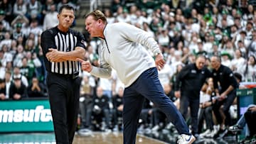 Illinois' head coach Brad Underwood, right, yells at a referee during the first half in the game against Michigan State on Sunday, Jan. 19, 2025, at the Breslin Center in East Lansing.