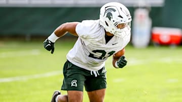 Michigan State's Dillon Tatum runs a drill during the first day of football camp on Tuesday, July 30, 2024, in East Lansing.