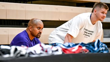 Moneyball Sportswear Founder Desmond Ferguson, left, talks to Michigan State basketball player Jaxon Kohler on Thursday, July 11, 2024, during the Moneyball Pro-Am at Holt High School.