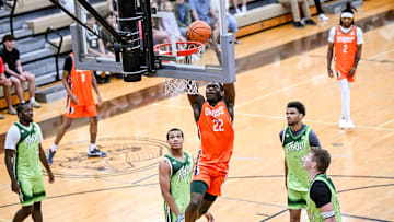 Team Snipes and Michigan State's Trey Fort dunks against Team Faygo during the Moneyball Pro-Am on Thursday, June 26, 2025, at Holt High School.