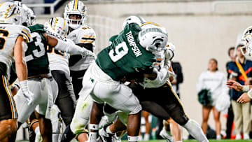 Michigan State's Jalen Thompson, left, tackles Western Michigan's Jalen Buckley for a safety during the third quarter on Friday, Aug. 29, 2025, in East Lansing.