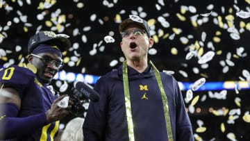 Michigan head coach Jim Harbaugh celebrates during the trophy presentation after the 34-13 win over Washington at the national championship game at NRG Stadium in Houston on Monday, Jan. 8, 2024.