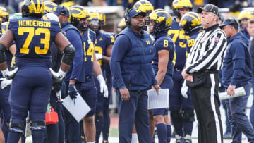 Michigan wide receivers coach Ron Bellamy watches a replay during the second half against Ohio State at Michigan Stadium in Ann Arbor on Saturday, Nov. 25, 2023.