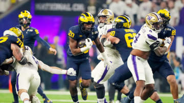 Michigan running back Kalel Mullings runs the ball during the first quarter of the College Football Playoff national championship game against Washington at NRG Stadium in Houston, Texas on Monday, Jan. 8, 2024.